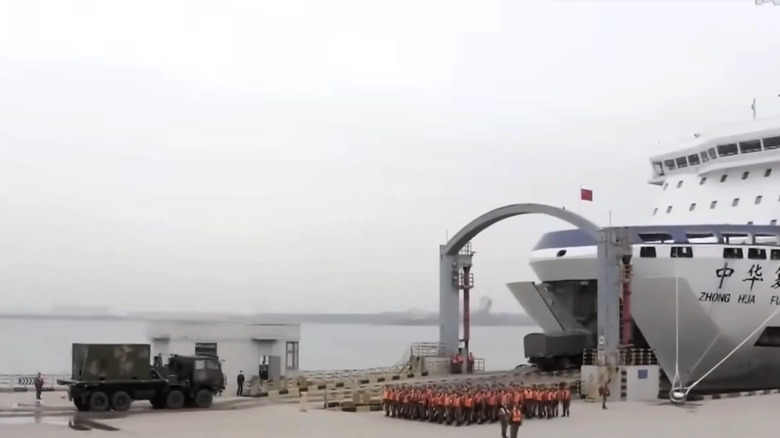 Military vehicles being loaded into the front of Ro-Ro ferry in China.