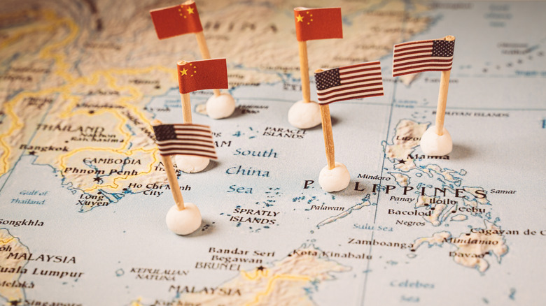 Flags of USA and China on a map