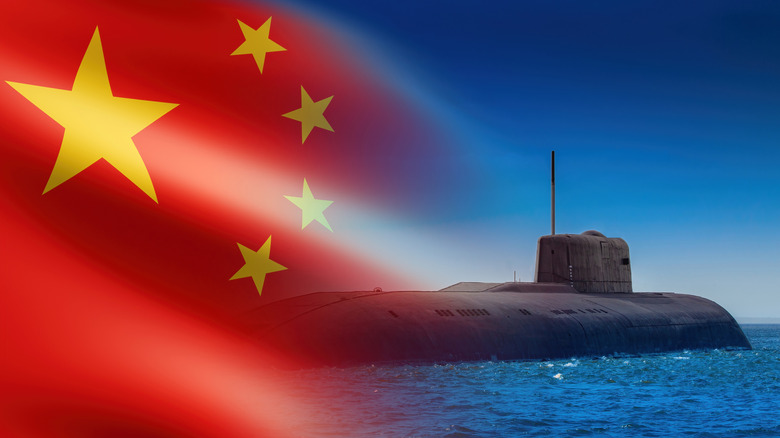 The Flag of People's Republic of China and a submarine on the surface