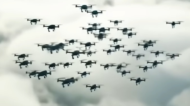 A swarm of kamikaze FMV loiter drone munitions