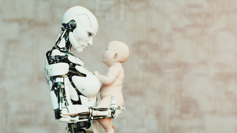 Humanoid robot holding baby