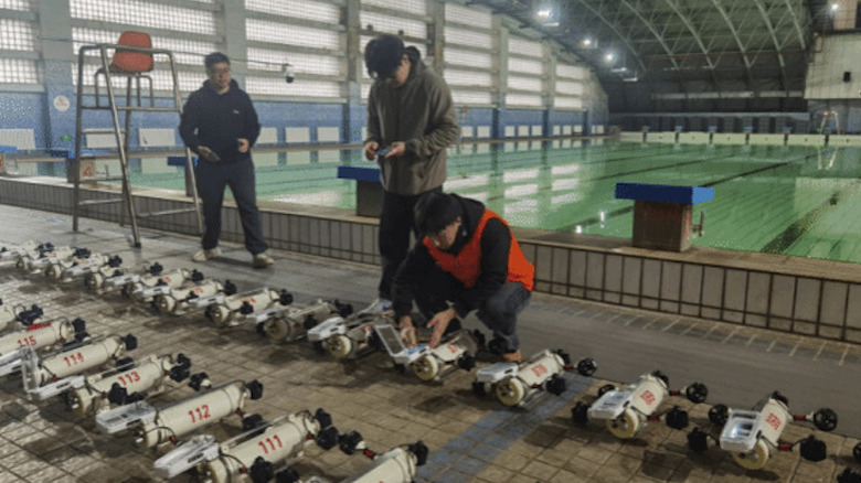 Students prepare to deploy drones in pool for world record attempt