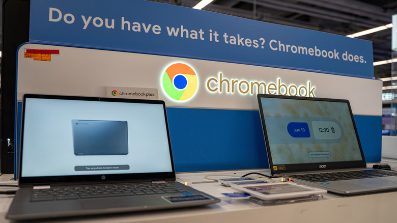 Google Chromebook display with two Chromebook laptops set up on a desk.