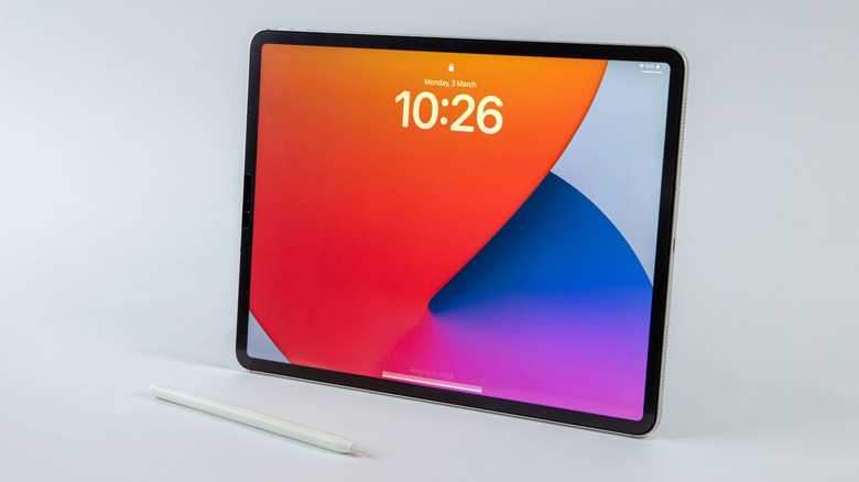 Apple iPad with Apple Pencil resting in front of it.