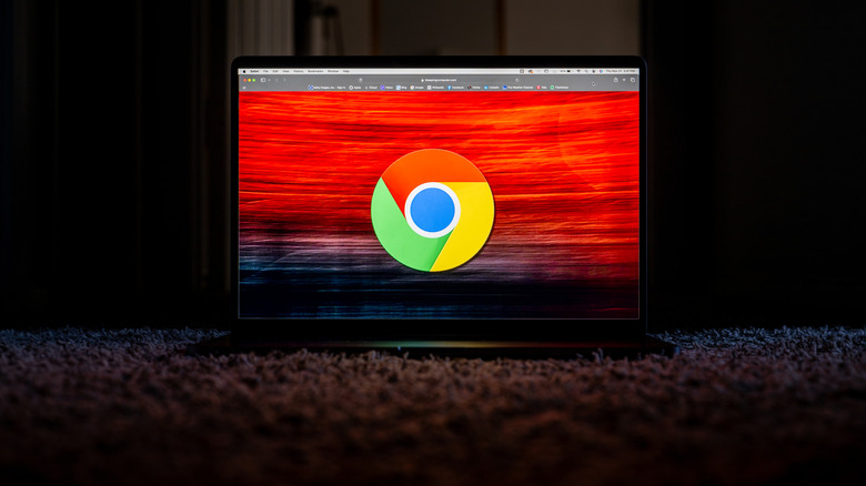 A picture of the Google Chrome logo on a laptop with an ominous looking red and black background
