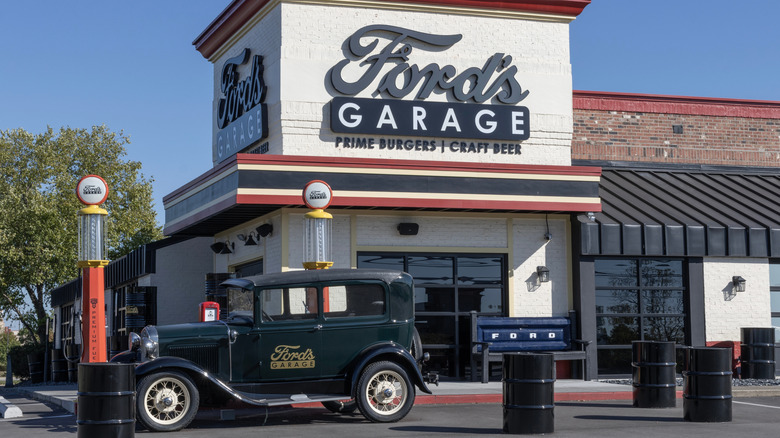 outside of ford's garage with classic car