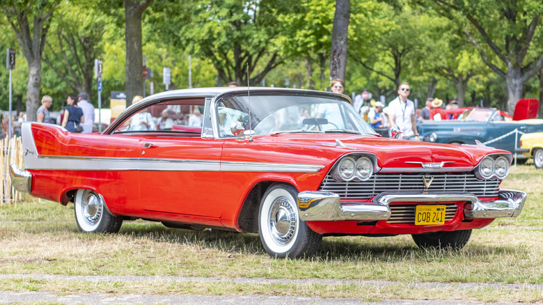 1958 red Plymouth Fury parked