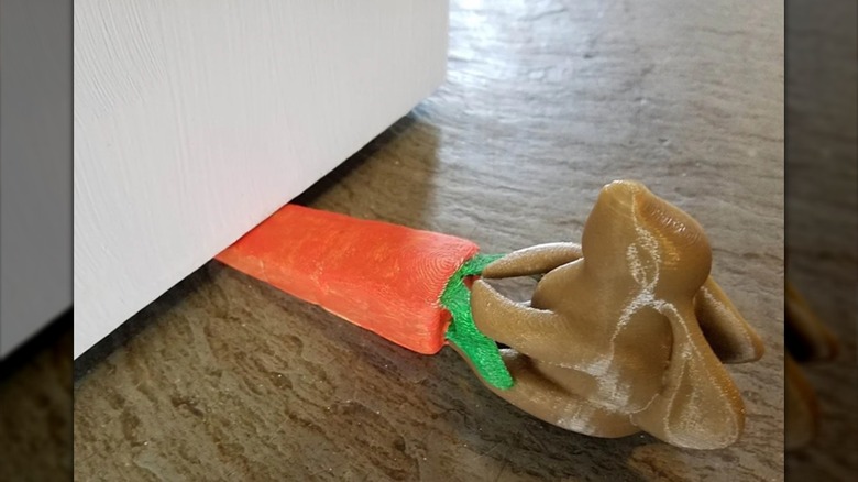 A bunny pulling a carrot style door stop