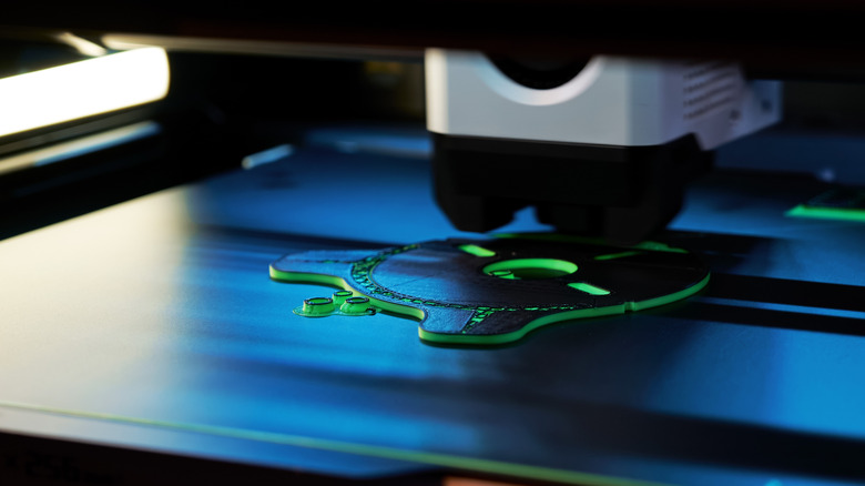 A 3D printer creating an item from filament.
