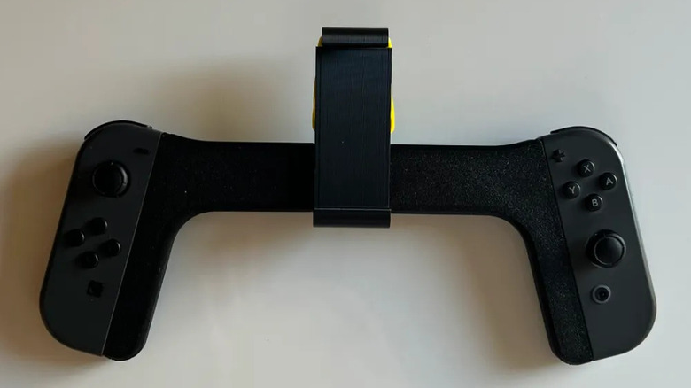 The Joy-Con phone mount lying on a desk