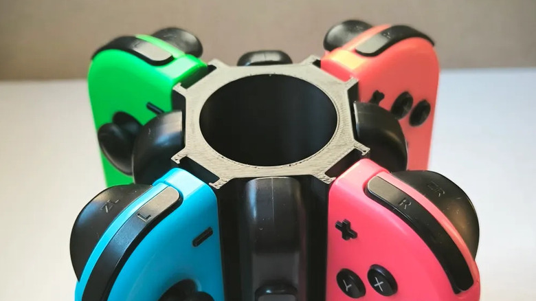 Four Nintendo Switch Joy-Cons mounted on a Joy-Con stand