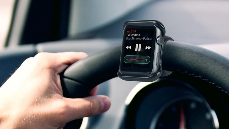 An Apple Watch mounted on a car steering wheel