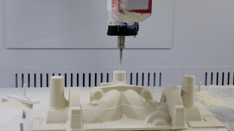 a CNC router machine making a mold using an epoxy tooling board.