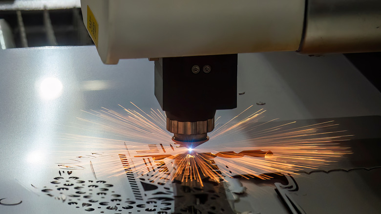 A fiber laser cutting machine cutting through stel plate