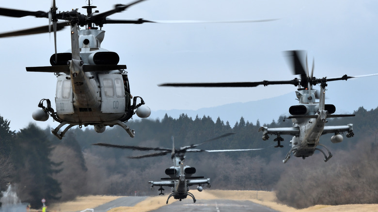 AH-1s in formation with a UH-1