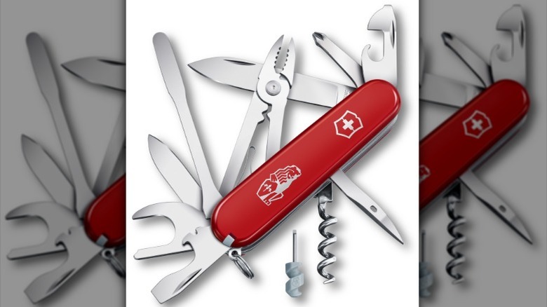 A shot of the Victorinox x La Marzocco barista tool with its various utilities opened.