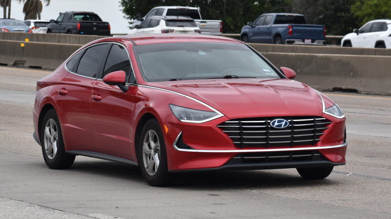 A red Hyundai Sonata on the street
