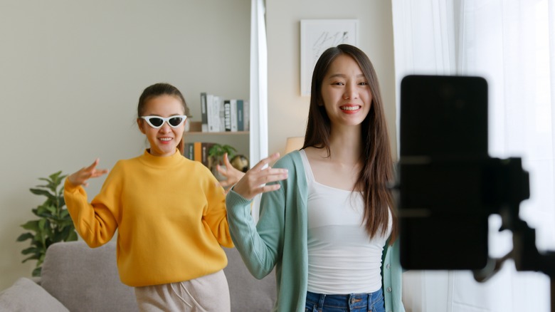 Two people recording a video
