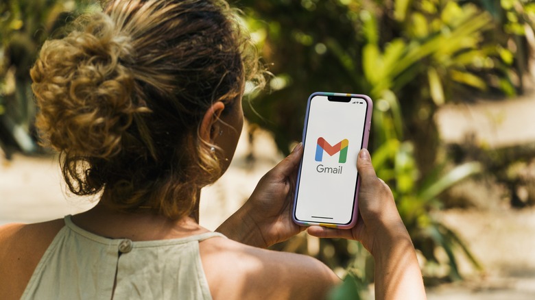 Woman using Gmail app on smartphone