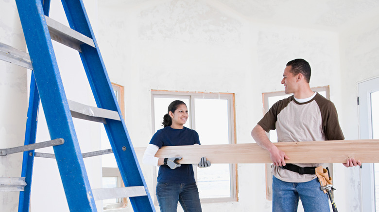 Couple working on home repair project