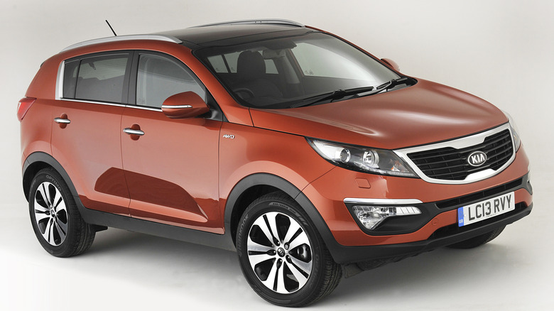 An orange 2013 Kia Sportage