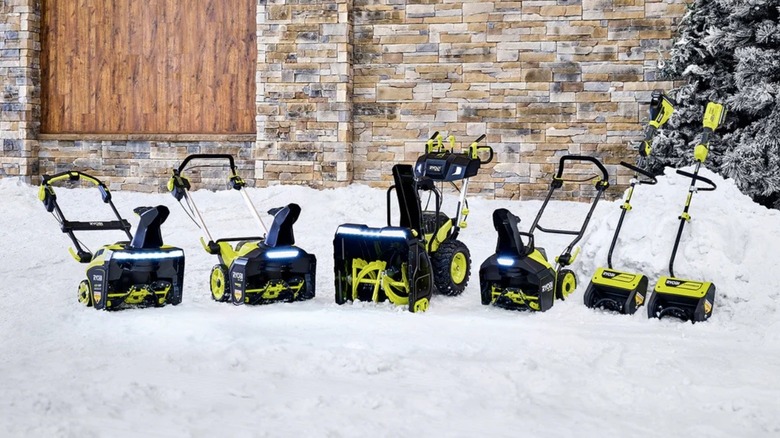 Ryobi snowblowers resting idly in the snow