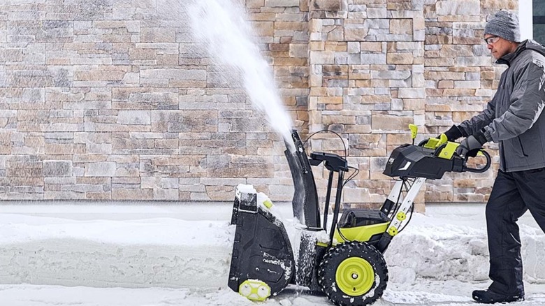 Many pushing a Ryobi snowblower