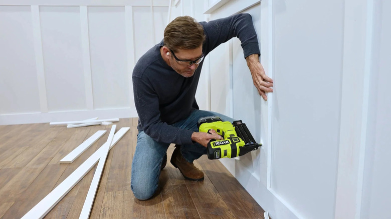 man using Ryobi Brad Nailer