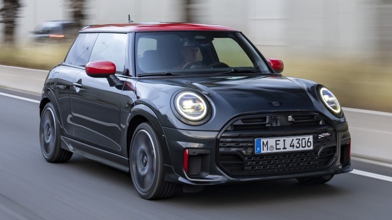 Black Mini cooper on highway