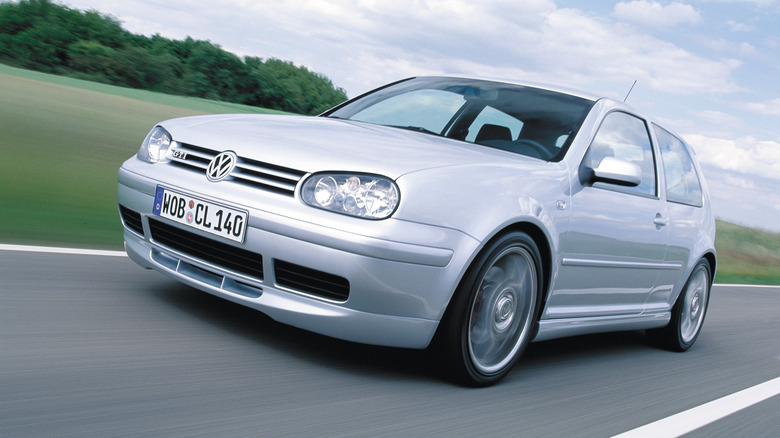 A silver Mk4 Volkswagen Golf GTI on the move, front 3/4 view