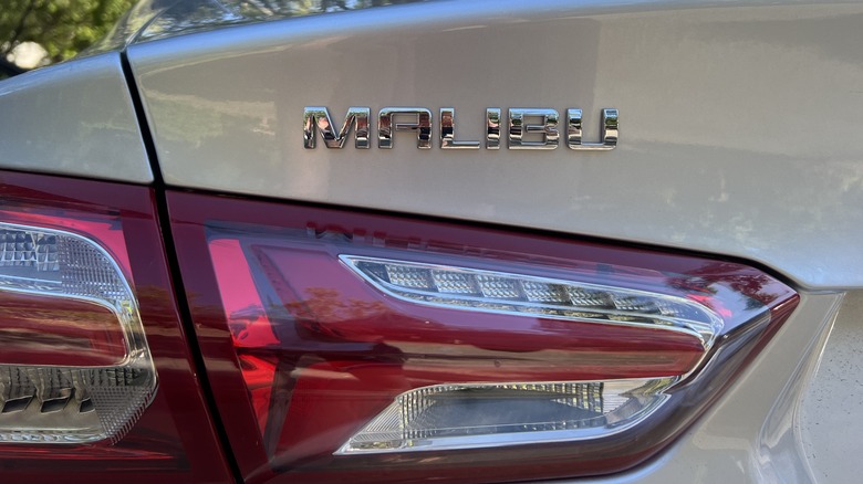 a close up of the 'Malibu' emblem right above the taillight of a Chevrolet Malibu