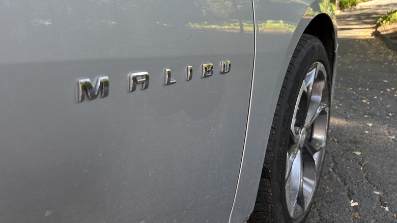 a close up of the Chevrolet Malibu nameplate and front wheel