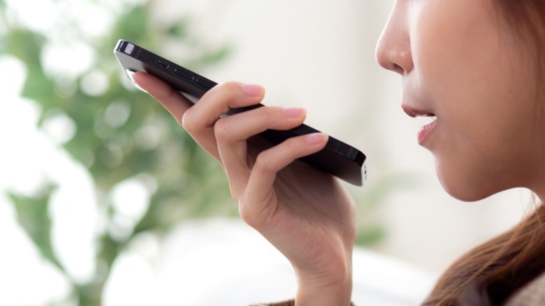 Person speaking into a phone