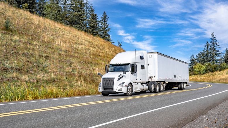 Truck on downhill mountain road