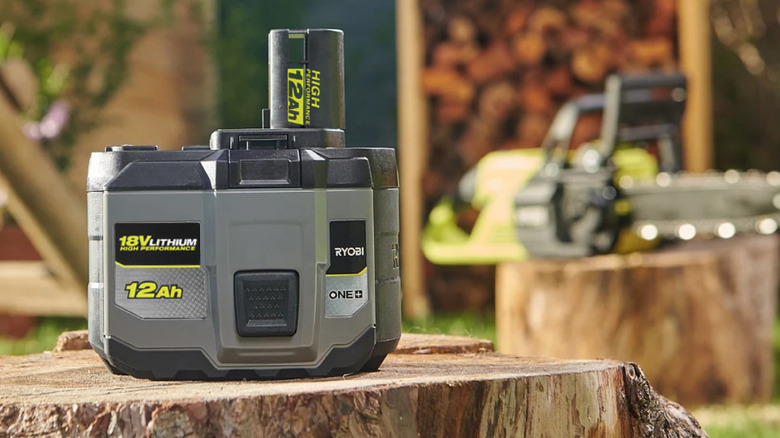 A Ryobi battery and chainsaw