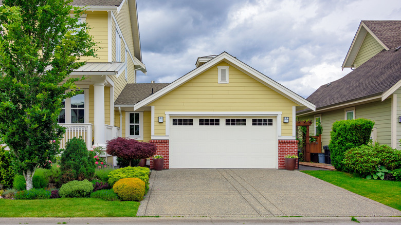 A home with a concrete driveway.