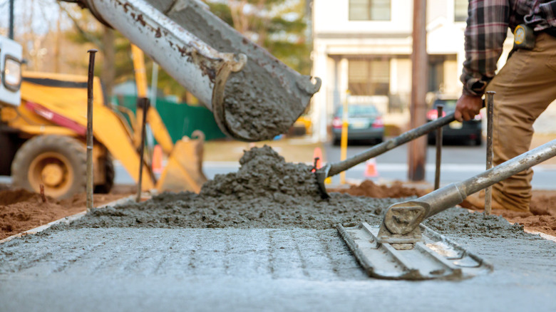 Workers pouring concrete