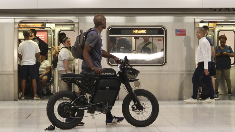 Man bringing e-bike on NYC subway