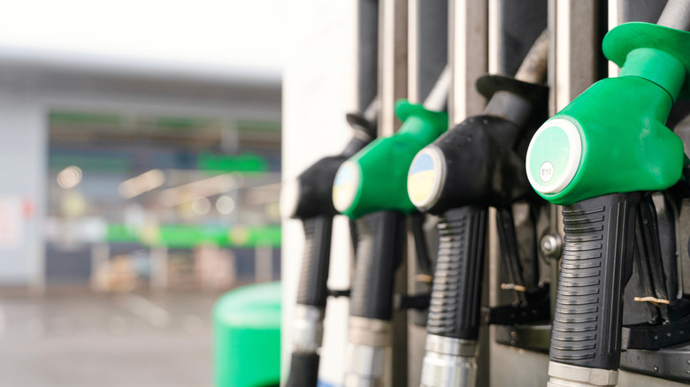 Close-up of diesel and gas nozzles at a petrol/gas station