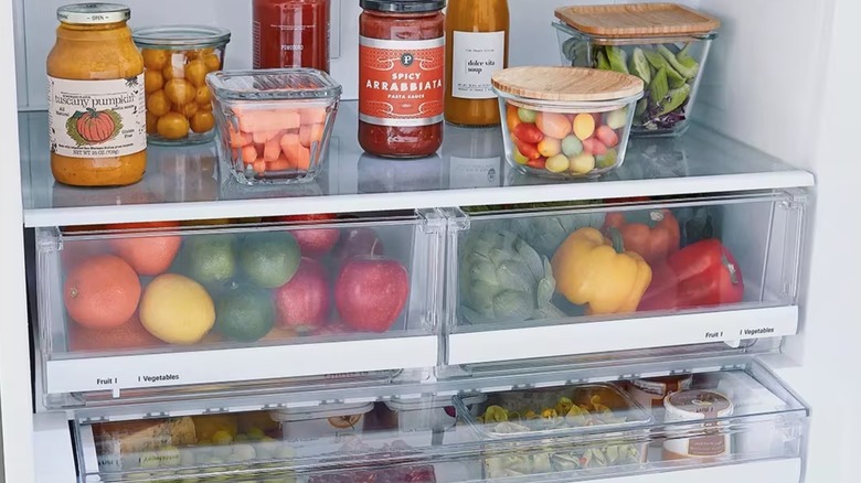 Perishable food items sitting on a shelf in an LG refrigerator