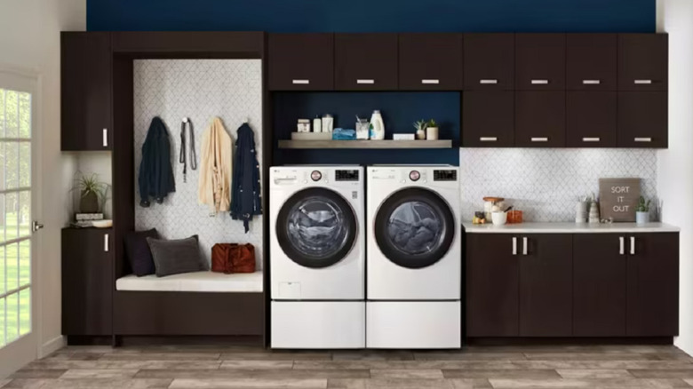 The LG WM4000HWA washing machine shown alongside a dryer in a modern laundry room in a home