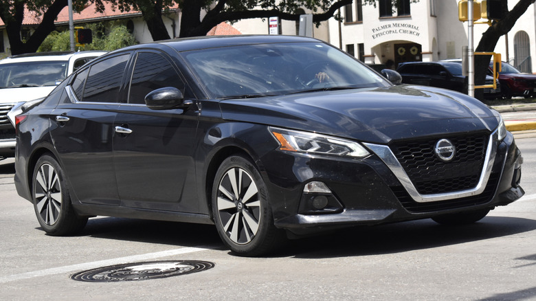 A Nissan Sentra sedan driving on a road