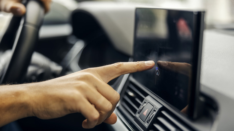 Driver interacting with a modern infotainment system