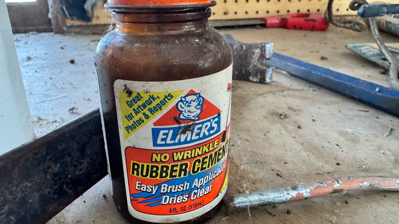 Container of rubber cement in workshop