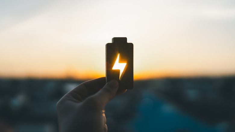 Battery symbol against a sky