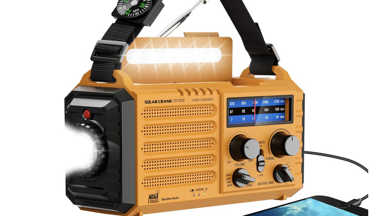 Exosmile portable emergency radio with an attached charging smartphone
