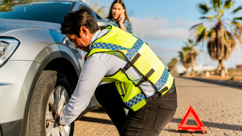Roadside assistance changing tire