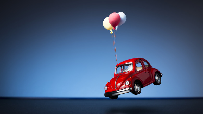Red VW Beetle floating in air