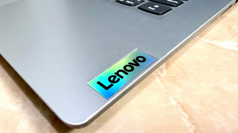 A close-up of the Lenovo logo on a laptop
