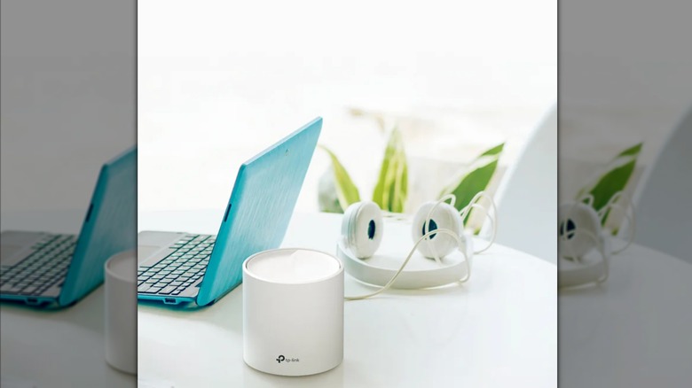 router on table with laptop